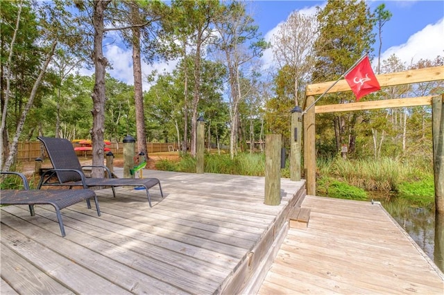 wooden deck with a water view