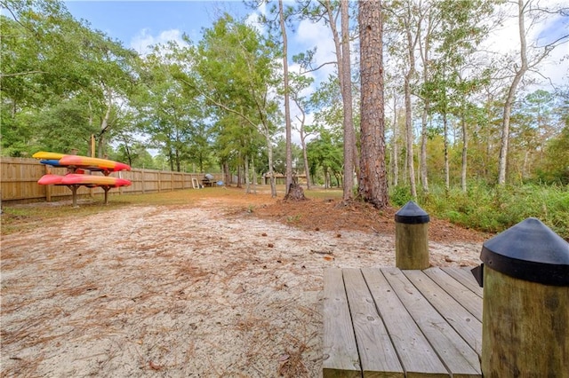 view of yard with a wooden deck