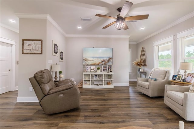 living room featuring ceiling fan, dark hardwood / wood-style flooring, and ornamental molding