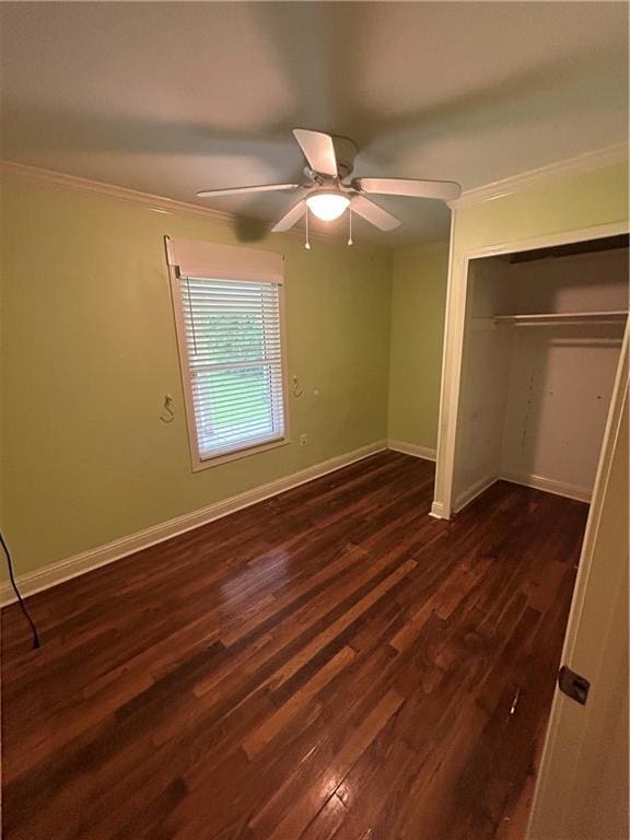 9016 Julie St, Mobile, AL 36608 - unfurnished bedroom with ornamental molding, dark wood-type flooring, baseboards, a closet, and ceiling fan