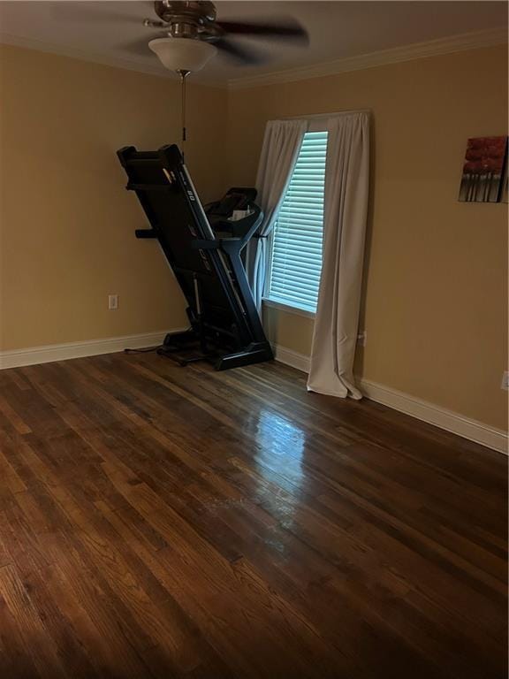 9016 Julie St, Mobile, AL 36608 - workout area with crown molding, a ceiling fan, baseboards, and dark wood-type flooring