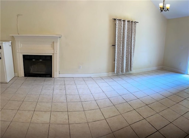 9016 Julie St, Mobile, AL 36608 - unfurnished living room featuring light tile patterned floors, a chandelier, a glass covered fireplace, high vaulted ceiling, and baseboards