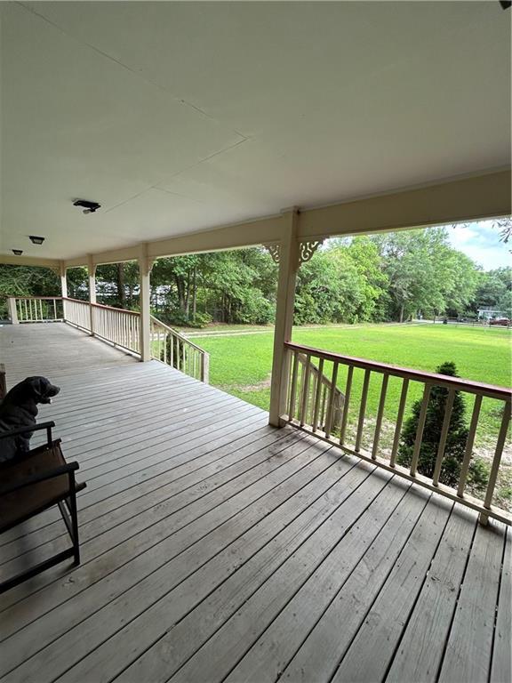 9016 Julie St, Mobile, AL 36608 - wooden deck with a yard