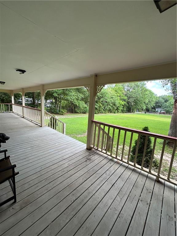 9016 Julie St, Mobile, AL 36608 - wooden deck with a lawn