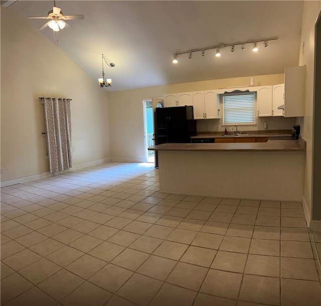 9016 Julie St, Mobile, AL 36608 - kitchen with freestanding refrigerator, a peninsula, open floor plan, a ceiling fan, and high vaulted ceiling