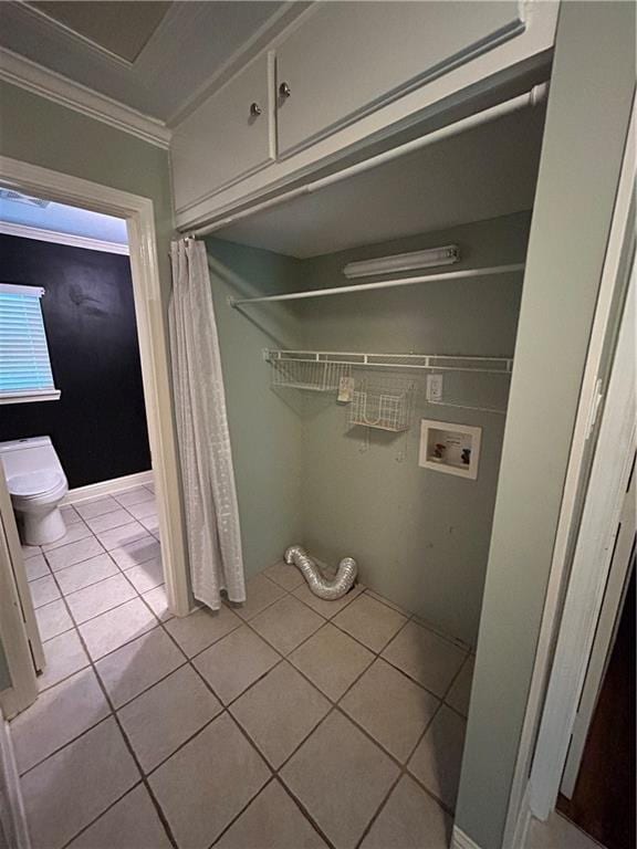 9016 Julie St, Mobile, AL 36608 - laundry room featuring hookup for a washing machine, crown molding, and tile patterned floors
