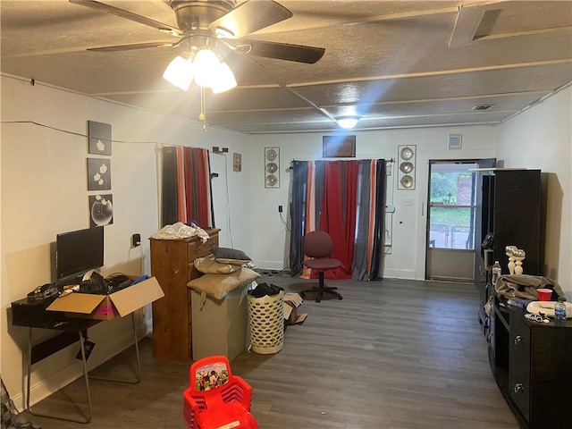 interior space featuring ceiling fan and dark hardwood / wood-style floors