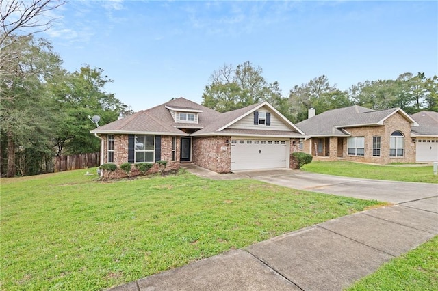 view of front of house featuring a front lawn, concrete driveway, and brick siding