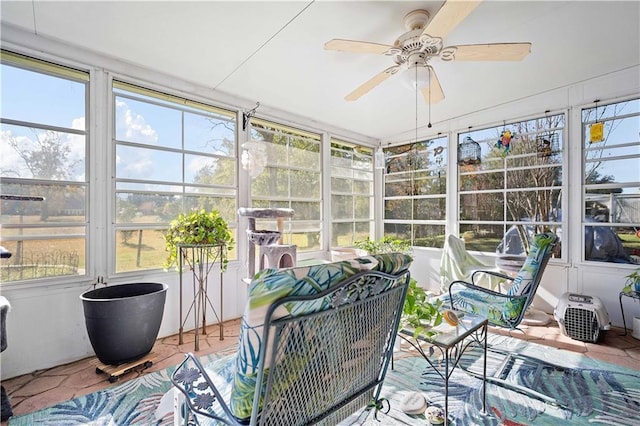 sunroom with ceiling fan and plenty of natural light