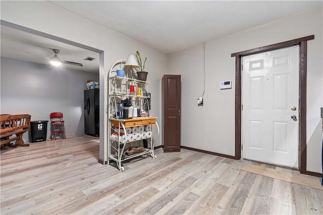 entryway with ceiling fan and light hardwood / wood-style flooring