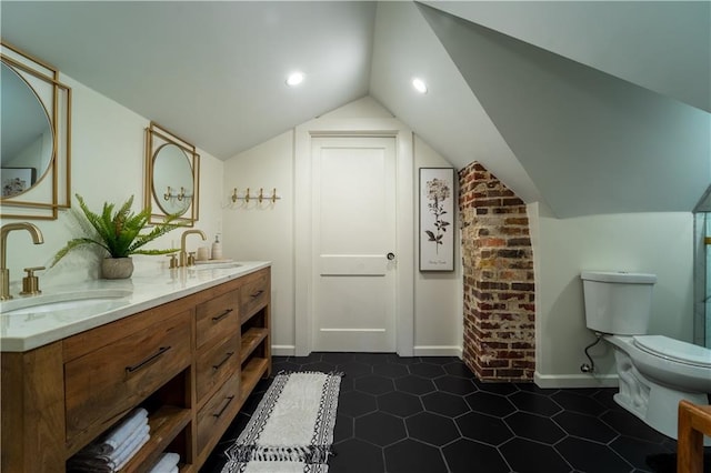 full bathroom with tile patterned flooring, a sink, toilet, and lofted ceiling
