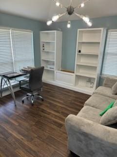 office area with a chandelier and dark wood-style floors