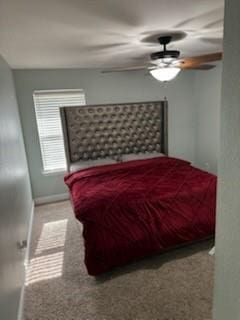 carpeted bedroom with baseboards and a ceiling fan