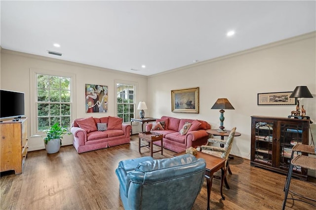 living room with crown molding, recessed lighting, visible vents, wood finished floors, and baseboards