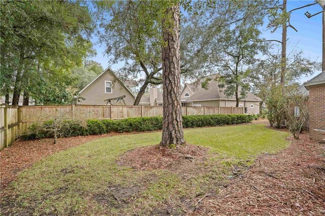 view of yard with a fenced backyard