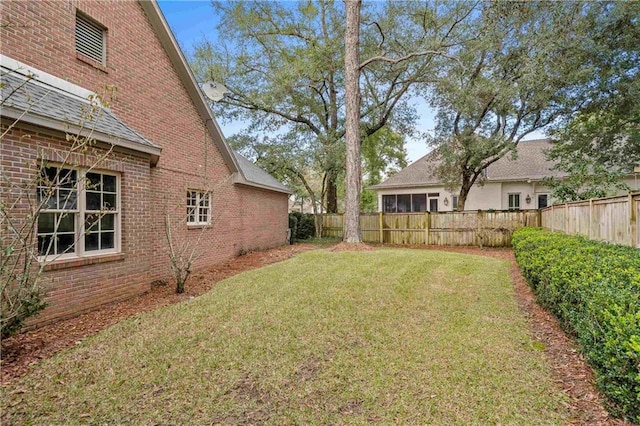 view of yard featuring a fenced backyard