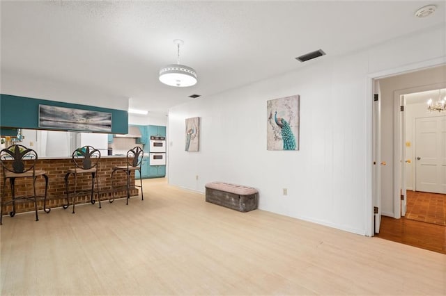 dining area featuring visible vents and wood finished floors