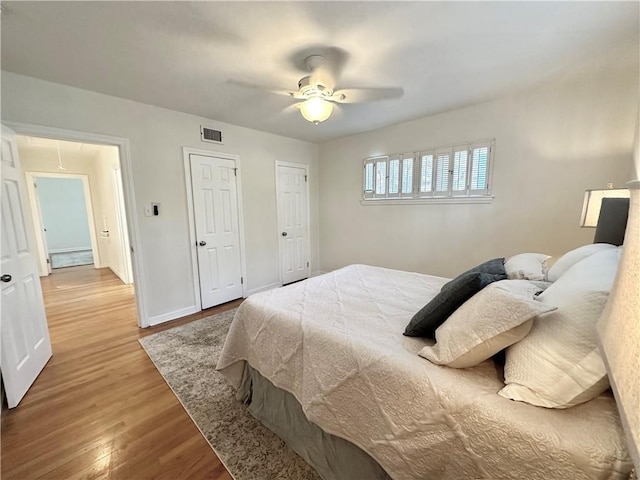 bedroom featuring hardwood / wood-style floors and ceiling fan