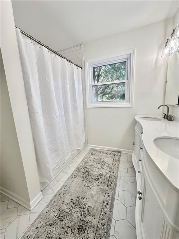 bathroom featuring a shower with curtain and vanity