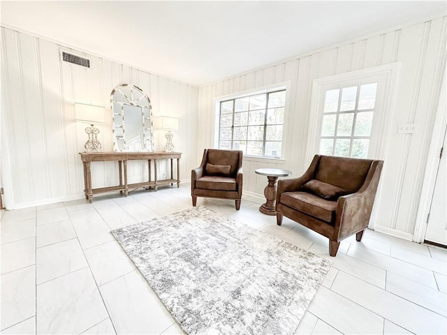 sitting room featuring tile patterned flooring