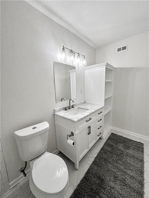 bathroom featuring vanity and toilet