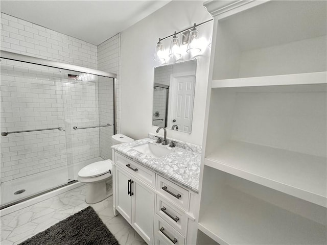 bathroom featuring vanity, toilet, and walk in shower