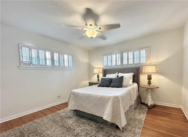 bedroom featuring hardwood / wood-style flooring and ceiling fan