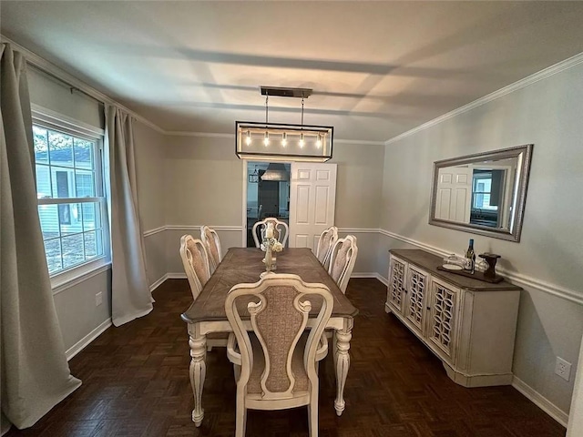 dining space featuring baseboards and ornamental molding