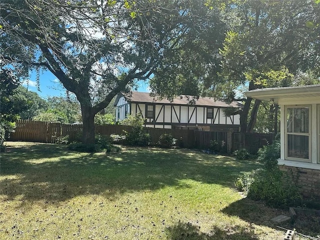 view of yard featuring fence