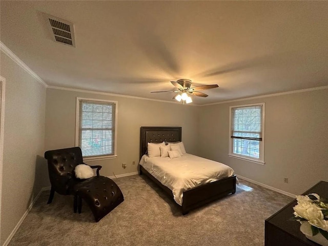 bedroom with baseboards, crown molding, visible vents, and carpet floors