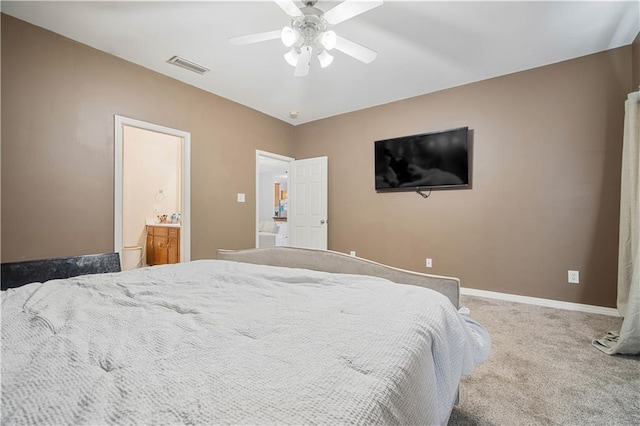 carpeted bedroom with connected bathroom and ceiling fan