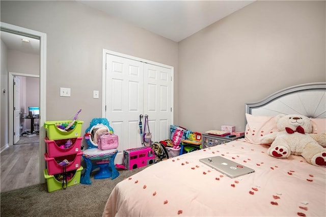 bedroom with carpet floors and a closet