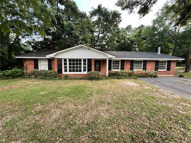 5855 Zeigler Blvd, Mobile, AL 36608 - ranch-style home with brick siding, driveway, and a front yard