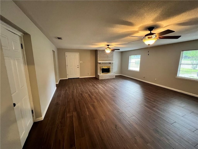5855 Zeigler Blvd, Mobile, AL 36608 - unfurnished living room featuring baseboards, visible vents, a ceiling fan, and dark wood-style floors