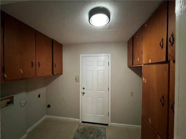 5855 Zeigler Blvd, Mobile, AL 36608 - laundry room with cabinet space, a textured ceiling, baseboards, and hookup for an electric dryer
