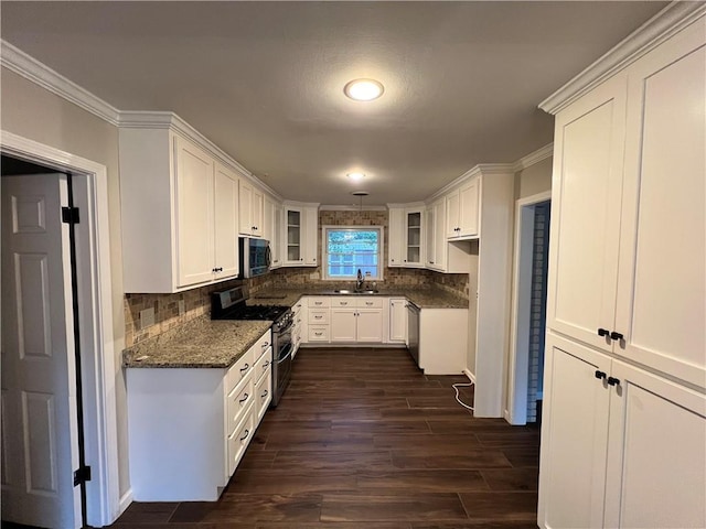 5855 Zeigler Blvd, Mobile, AL 36608 - kitchen featuring white cabinets, glass insert cabinets, stainless steel appliances, and a sink