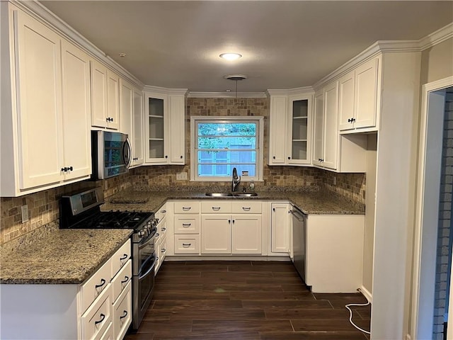 5855 Zeigler Blvd, Mobile, AL 36608 - kitchen featuring a sink, glass insert cabinets, stainless steel appliances, white cabinetry, and dark wood-style floors