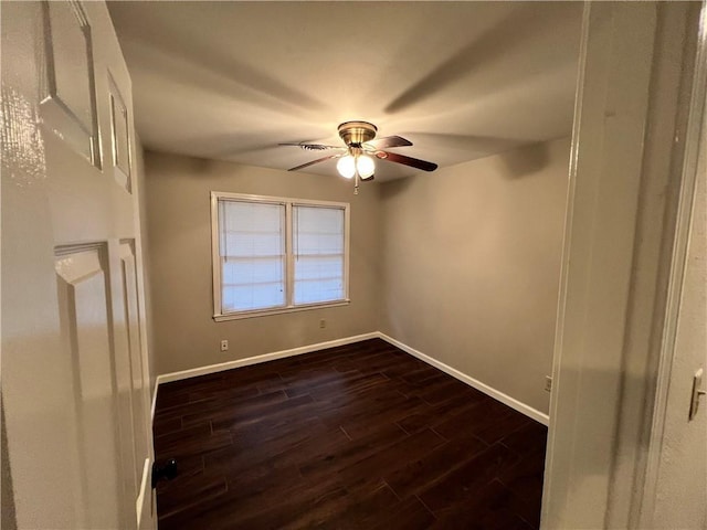 5855 Zeigler Blvd, Mobile, AL 36608 - unfurnished room featuring a ceiling fan, baseboards, and dark wood-style flooring