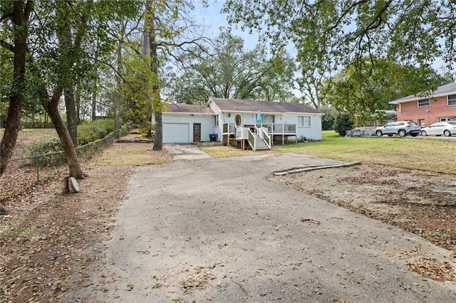 view of front facade with a garage and a front yard