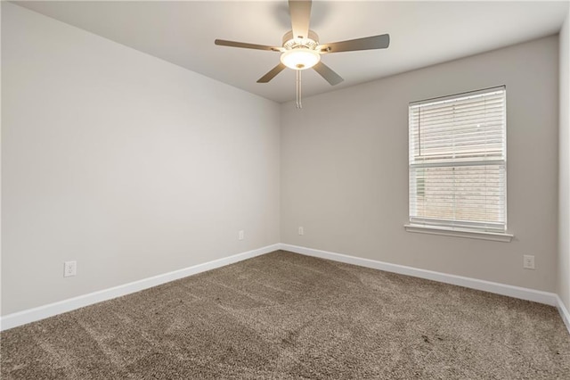 empty room featuring carpet flooring and ceiling fan