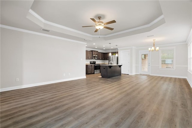 unfurnished living room featuring dark hardwood / wood-style flooring, ceiling fan with notable chandelier, crown molding, and a raised ceiling