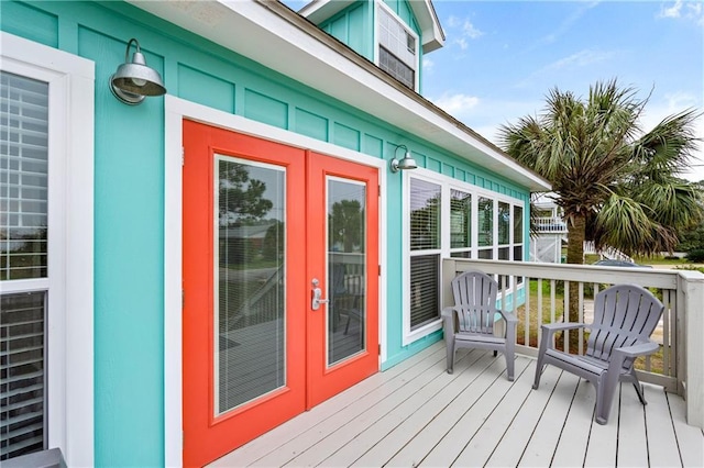 wooden deck featuring french doors