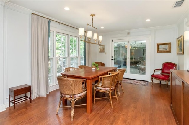 6000 Shenandoah Rd N, Mobile, AL 36608 - dining area featuring crown molding, wood finished floors, a decorative wall, and recessed lighting