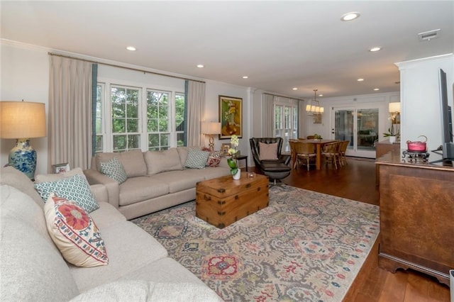 6000 Shenandoah Rd N, Mobile, AL 36608 - living area featuring wood finished floors, crown molding, recessed lighting, and a chandelier