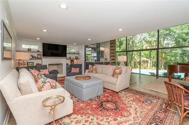 6000 Shenandoah Rd N, Mobile, AL 36608 - tiled living area with recessed lighting, a fireplace, and expansive windows