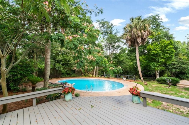 6000 Shenandoah Rd N, Mobile, AL 36608 - outdoor pool with a wooden deck and view of wooded area