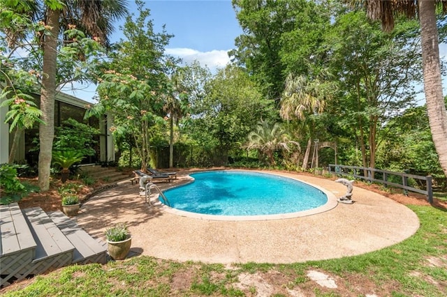 6000 Shenandoah Rd N, Mobile, AL 36608 - outdoor pool featuring fence, a patio area, and view of scattered trees