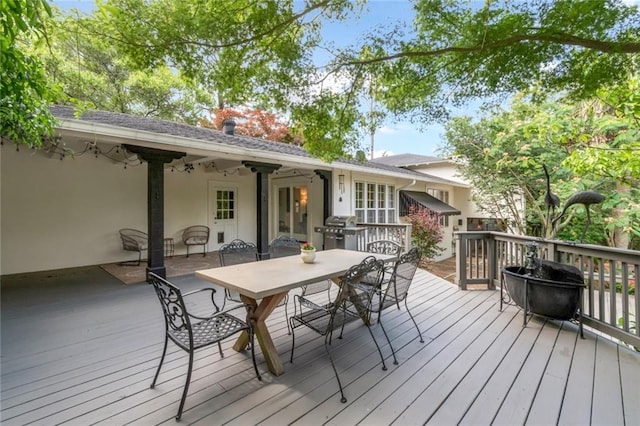 6000 Shenandoah Rd N, Mobile, AL 36608 - deck featuring outdoor dining space and a grill