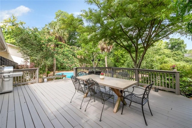 6000 Shenandoah Rd N, Mobile, AL 36608 - wooden deck featuring outdoor dining space and a grill