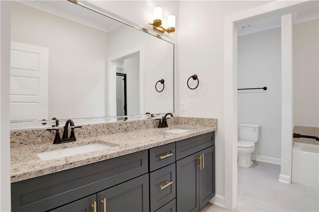 bathroom with vanity, toilet, and crown molding